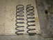 1995 Jeep YJ - Two coil springs are shown, likely for a vehicle's suspension system.