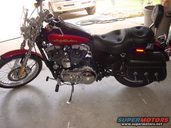 Purple and red 2006 Harley-Davidson Sportster Custom motorcycle, side view