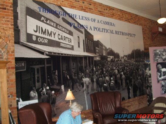 Mural of Jimmy Carter campaign in Plains, Georgia, with a crowd on a street