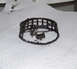 1988 Ford Bronco - This is a damaged wheel bearing cage and roller, likely from a vehicle's wheel assembly.