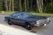 1978 Dodge Monaco - This 1978 Dodge Monaco is shown in a three-quarter front view, highlighting its distinctive grille and dark gray exterior.
