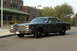 1978 Dodge Monaco - A dark sedan with a distinctive grille and chrome bumper is shown from a three-quarter front angle.