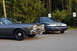 1978 Dodge Monaco - A 1978 Dodge Monaco is parked in front of a blue and gray sedan with trees in the background.