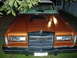 1983 Lincoln Town Car - This 1983 Lincoln Town Car is shown from the front, a prominent chrome grille and a custom hood scoop.