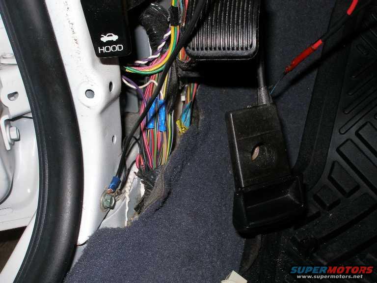 I ran a new ground for the driver's side courtesy lamp.

This ground is under the driver's side kick panel.