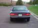 1998 Ford Crown Victoria - Rear view of a black 1998 Ford Crown Victoria sedan parked outdoors.
