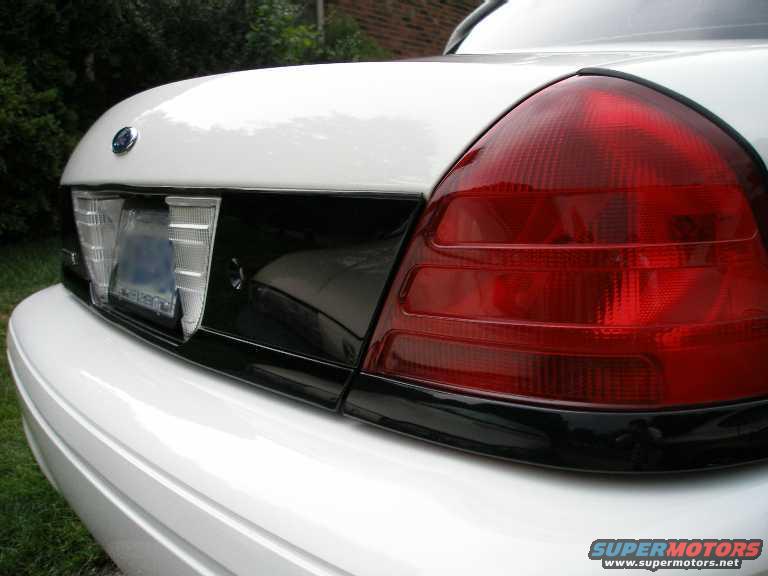 Close-up of a 2001 Ford Crown Victoria's rear, showing the taillight and trunk area