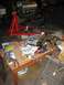 1969 Ford Mustang - Engine on stand with parts laid out on a table, garage setting with a car in the background.