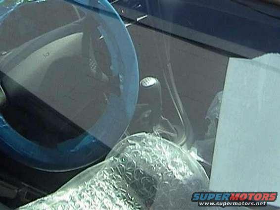 1989 Ford Mustang interior with bubble-wrapped dashboard and steering wheel