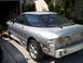1993 Ford Probe - The rear of a silver coupe is shown with its bumper removed, revealing the car's internal structure.