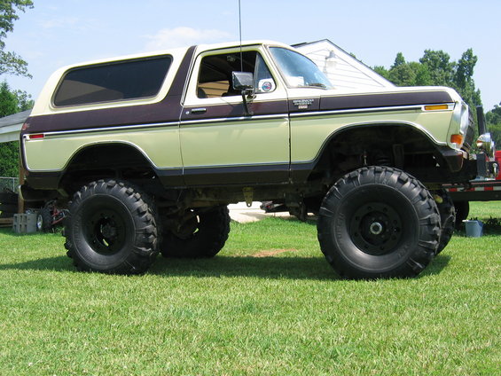 Lifted Ford Bronco with large tires, two-tone paint job