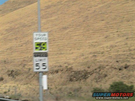 Speed limit sign shows 55, your speed is 59