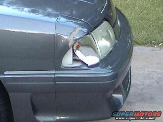 1989 Ford Mustang front fender and broken headlight assembly