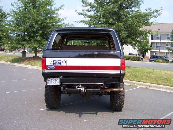 1990 Ford Bronco rear view with custom bumper and hitch. License plate TSR-2464