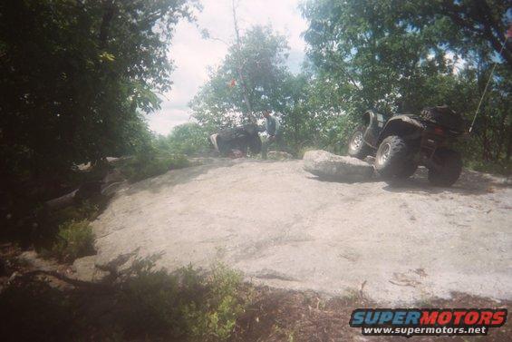 ATV on rocky terrain, rear view