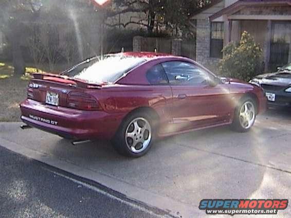 Red 1994 Ford Mustang GT rear 3/4 view