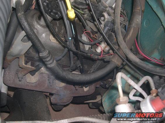 You can barely tell...but that's the smoke leaking out between my manifold and the y-pipe...so i found my leak!!!