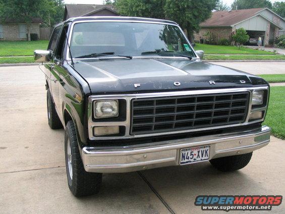 Front view of a black 1983 Ford Bronco with a chrome grille and license plate N45-XVK