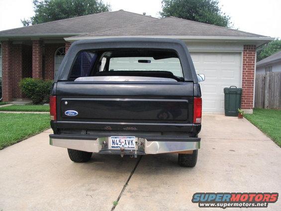 Black Ford Bronco rear view, parked in driveway