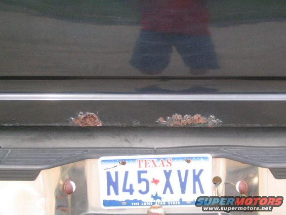 Rear bumper with rust spots and Texas license plate N45-XVK