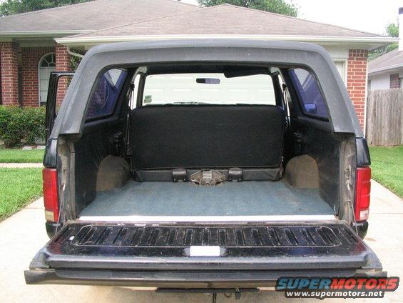 1983 Ford Bronco rear interior with tailgate down and folded seat