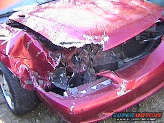 Red car with heavily damaged front end