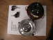 1996 Toyota 4Runner - Disassembled headlight assembly and bulbs laid out on a table with text visible.