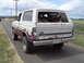 1955 Ford F-100 - This weathered Ford Bronco, likely from the 1980s, is parked on the side of a rural road.