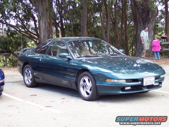 Teal 1995 Ford Probe GT coupe with a spoiler and chrome wheels