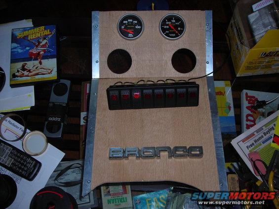 Custom dashboard panel with two gauges, six switches, and "BRONCO" emblem