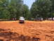 1995 Ford C-350 (Centurion Conversions) - Off-road vehicles navigate a muddy track during an event in July 2006.