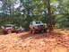 1995 Ford C-350 (Centurion Conversions) - Off-road vehicles navigate a challenging muddy terrain during an event.