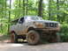 1995 Ford C-350 (Centurion Conversions) - This modified Ford Bronco is equipped for off-road use, with large tires and a lifted suspension.