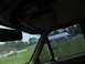 1995 Ford C-350 (Centurion Conversions) - View from inside a vehicle shows a trailer being towed by a pickup truck, with a gas station and other vehicles visible in the background.