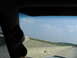 1995 Ford C-350 (Centurion Conversions) - View from inside a vehicle showing aftermarket gauges and a highway scene with a city in the distance.