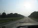 1995 Ford C-350 (Centurion Conversions) - View from inside a vehicle driving down a highway on a hazy day.