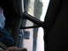 1995 Ford C-350 (Centurion Conversions) - View from inside a vehicle, looking out the window past the side mirror.