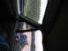 1995 Ford C-350 (Centurion Conversions) - Interior view of a 1995 Ford C-350 (Centurion Conversions) with a reflection of the road in the side mirror.