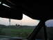 1995 Ford C-350 (Centurion Conversions) - View from the passenger seat looking out at a rural landscape during twilight.
