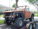 1977 Ford Bronco - This 1977 Ford Bronco is being transported on a trailer, missing its front grille and bumper.