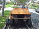 1977 Ford Bronco - This 1977 Ford Bronco is on a trailer, showing its front end with missing grille.