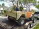 1977 Ford Bronco - A 1977 Ford Bronco is being transported on a trailer, accompanied by a white pickup truck.
