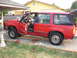 1992 Ford Explorer - 1992 Ford Explorer parked outside with driver's side doors open.