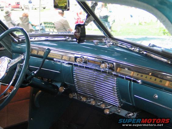 Teal dashboard with chrome accents and a "FRAZER" badge