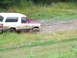 1990 Ford Bronco - Ford Bronco navigating a muddy trail during an off-road excursion.