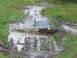 1990 Ford Bronco - Ford Bronco navigating a challenging muddy off-road path.