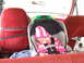 1990 Ford Bronco - A baby naps peacefully in a car seat, accompanied by a watchful dog, inside a vehicle with red upholstery.