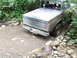 1990 Ford Bronco - This 1990 Ford Bronco navigates a rocky creek bed, its rear end visible as it splashes through the water.