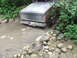 1990 Ford Bronco - 1990 Ford Bronco navigating a rocky creek bed during an off-road excursion.