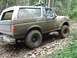 1990 Ford Bronco - This 1990 Ford Bronco is covered in mud after driving on a rough, rocky trail through the woods.